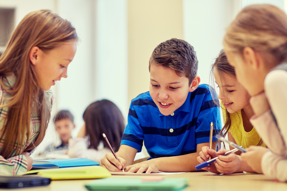 Students learning together around a table